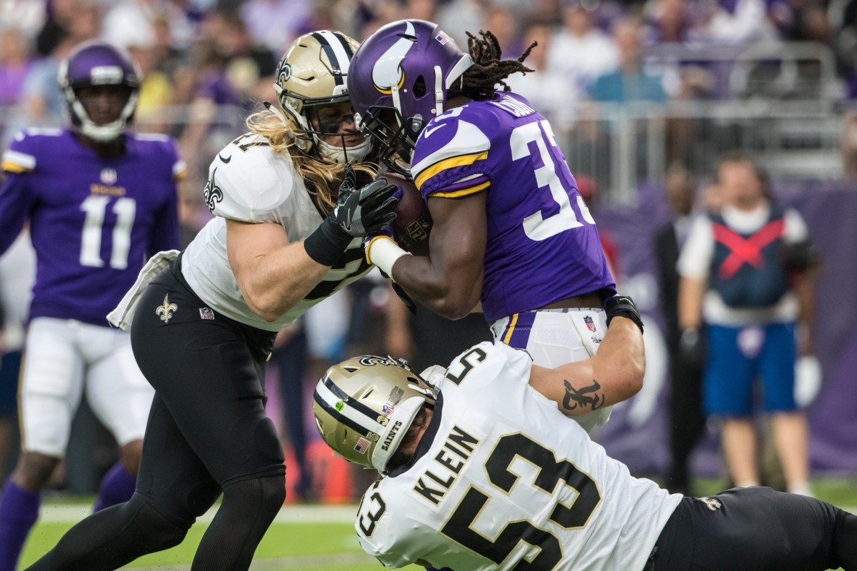 Sep 11, 2017; Minneapolis, MN, USA; Minnesota Vikings running back Dalvin Cook (33) is tackled by New Orleans Saints linebacker Alex Anzalone (47) and linebacker A.J. Klein (53) during the first quarter at U.S. Bank Stadium. Mandatory Credit: Brace Hemmelgarn-USA TODAY