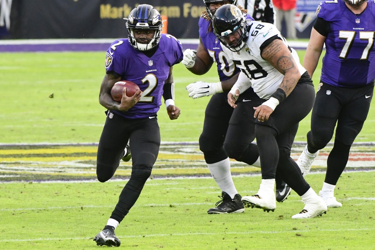 Dec 20, 2020; Baltimore, Maryland, USA; Baltimore Ravens quarterback Tyler Huntley (2) runs during the fourth quarter against the Jacksonville Jaguars at M&T Bank Stadium.