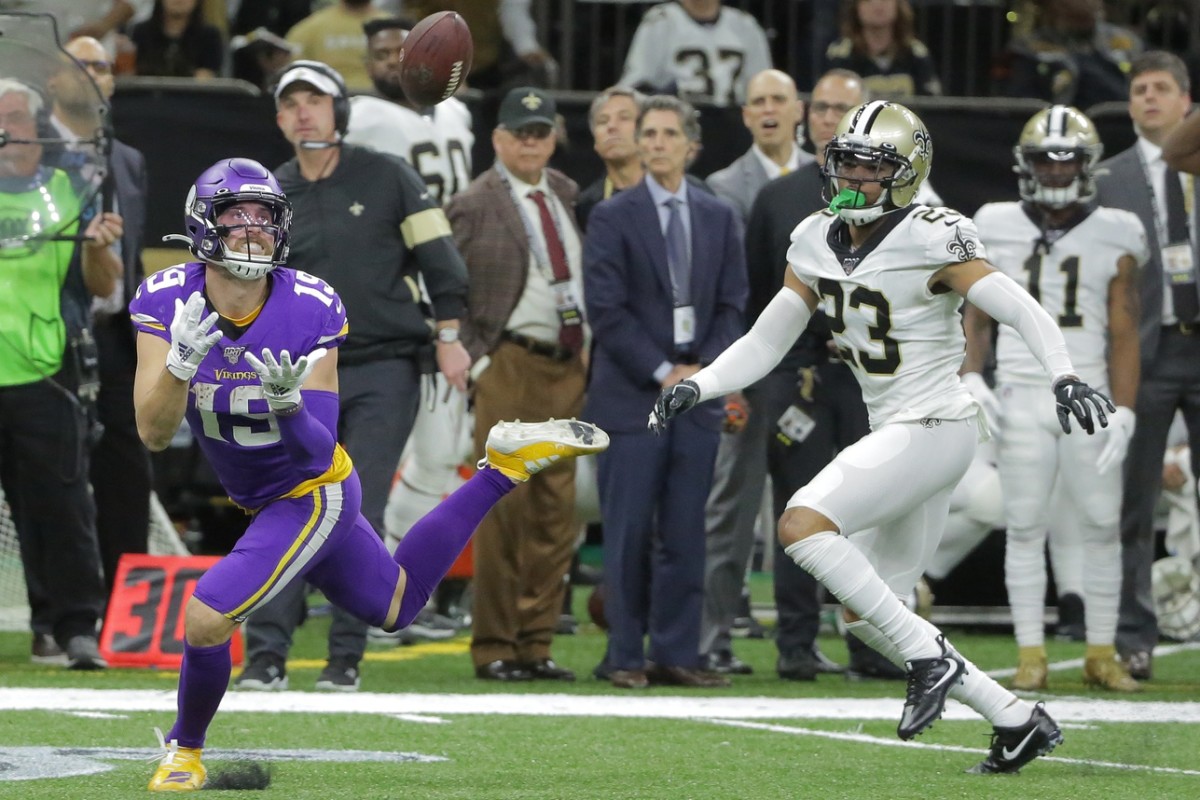 Jan 5, 2020; New Orleans, Louisiana, USA; Minnesota Vikings wide receiver Adam Thielen (19) catches a pass against New Orleans Saints cornerback Marshon Lattimore (23) during the third quarter of a NFC Wild Card playoff football game at the Mercedes-Benz Superdome. Mandatory Credit: Derick Hingle-USA TODAY 