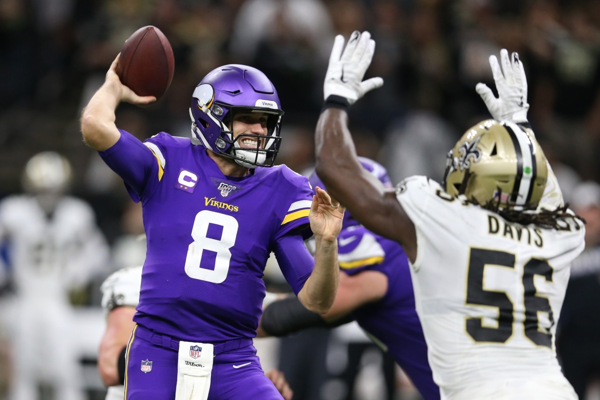 Jan 5, 2020; New Orleans, Louisiana, USA; Minnesota Vikings quarterback Kirk Cousins (8) throws a pass against New Orleans Saints outside linebacker Demario Davis (56) during the second quarter of a NFC Wild Card playoff football game at the Mercedes-Benz Superdome. Mandatory Credit: Chuck Cook -USA TODAY 