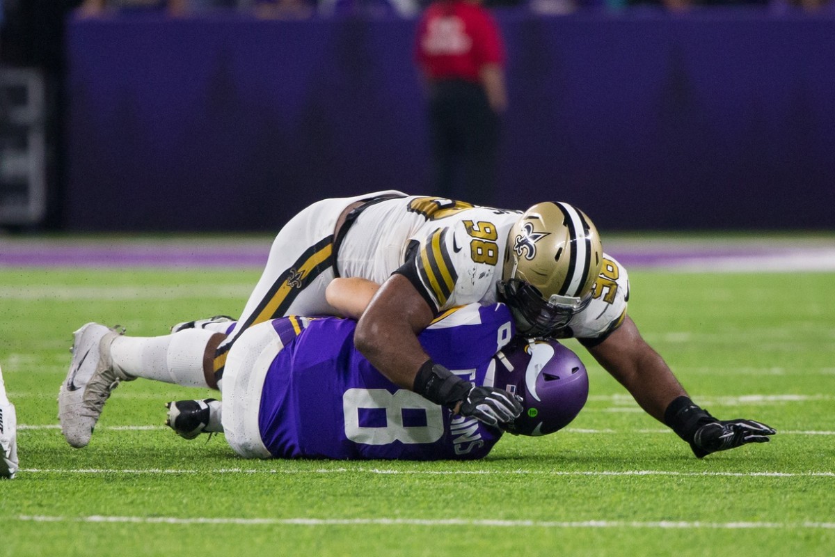 Oct 28, 2018; Minneapolis, MN, USA; New Orleans Saints defensive lineman Sheldon Rankins (98) sacks Minnesota Vikings quarterback Kirk Cousins (8) in the third quarter at U.S. Bank Stadium. Mandatory Credit: Brad Rempel-USA TODAY