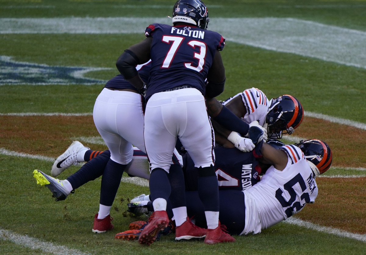 Khalil Mack (52) leads a sack for a safety on Deshaun Watson. Mandatory Credit: Mike Dinovo-USA TODAY Sports