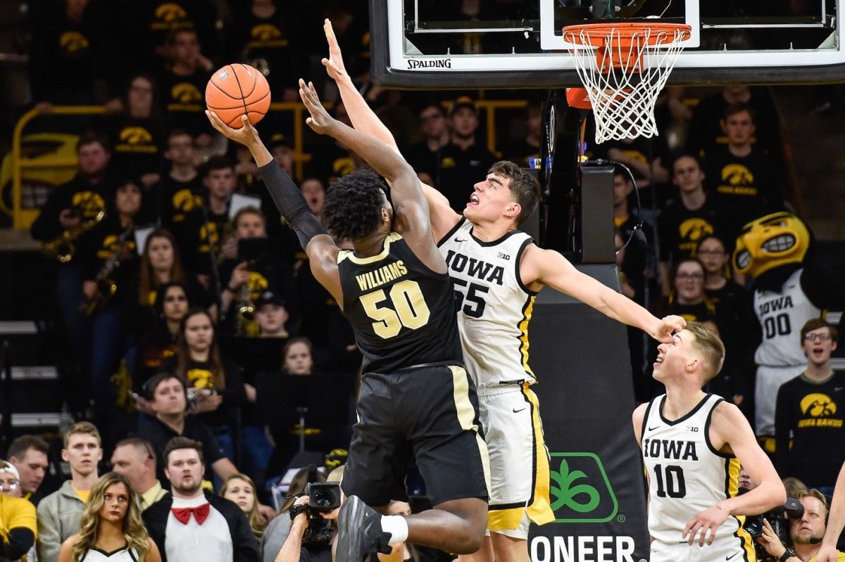 Iowa center Luka Garza (55) leads the Big Ten in scoring, averaging 29.3 points per game. (USA TODAY Sports)