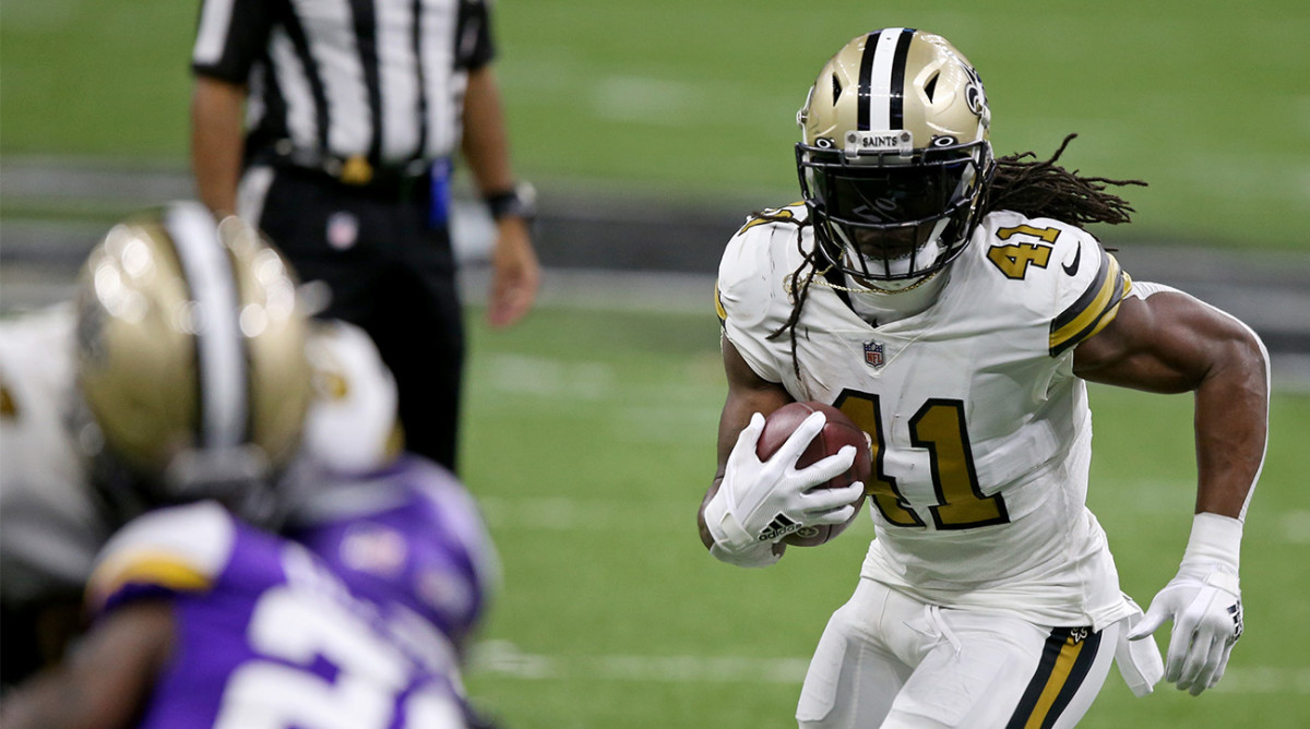 Alvin Kamara runs the ball for the Saints.