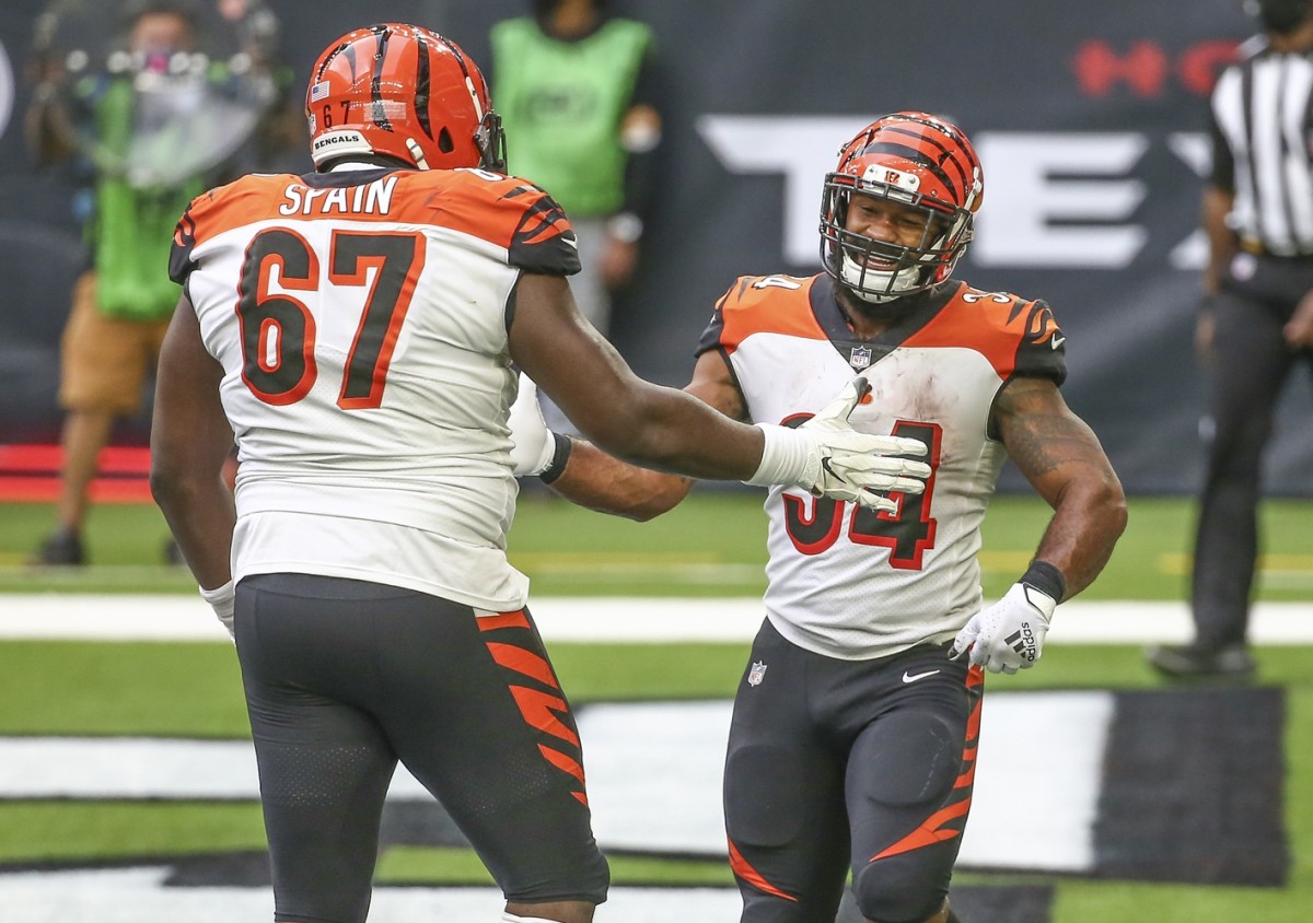 Cincinnati Bengals running back Samaje Perine (34) celebrates with offensive guard Quinton Spain (67) after scoring a touchdown against the Houston Texans during the fourth quarter at NRG Stadium.