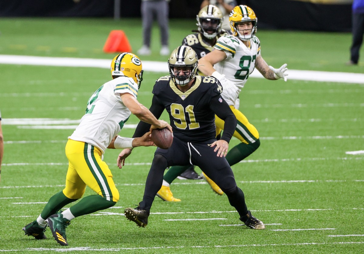 Sep 27, 2020; New Orleans, Louisiana, USA; New Orleans Saints defensive end Trey Hendrickson (91) pressures Green Bay Packers quarterback Aaron Rodgers (12) during the first quarter at the Mercedes-Benz Superdome. Mandatory Credit: Derick E. Hingle-USA TODAY Sports