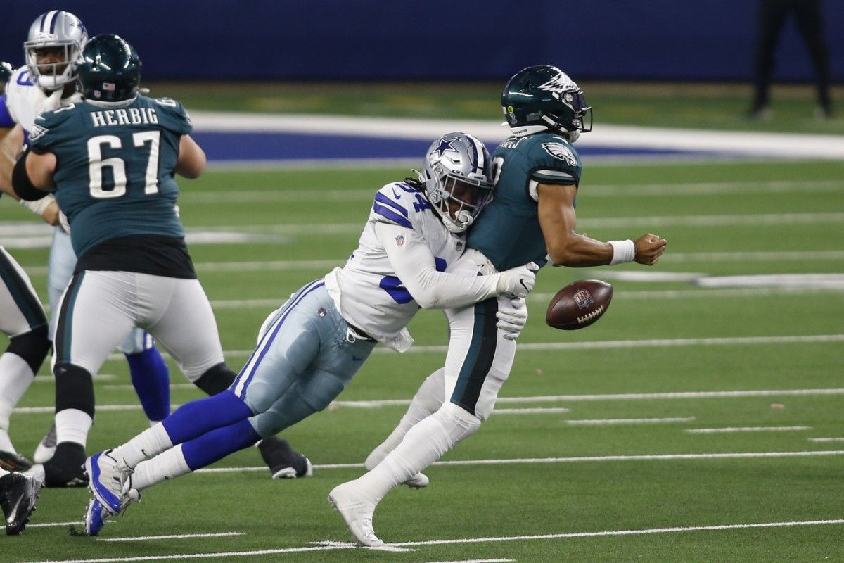 Jalen Hurts gets sacked by Randy Gregory