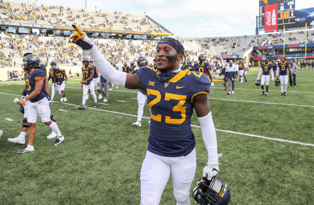 Nov 14, 2020; Morgantown, West Virginia, USA; West Virginia Mountaineers safety Tykee Smith (23) celebrates after defeating the TCU Horned Frogs at Mountaineer Field at Milan Puskar Stadium.