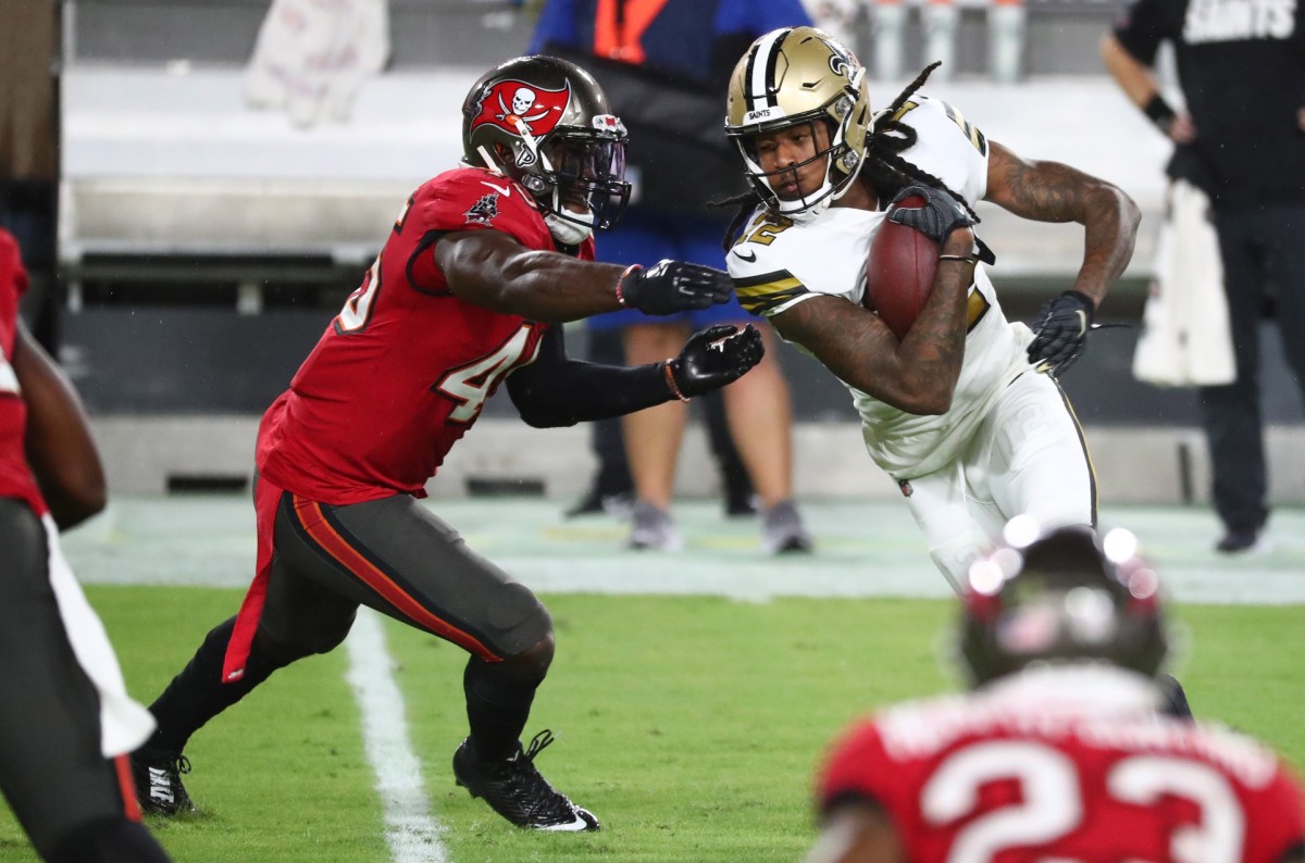 Nov 8, 2020; Tampa, Florida, USA; New Orleans Saints wide receiver Marquez Callaway (12) runs the ball as Tampa Bay Buccaneers inside linebacker Devin White (45) defends in the first quarter of a NFL game at Raymond James Stadium. Mandatory Credit: Kim Klement-USA TODAY 