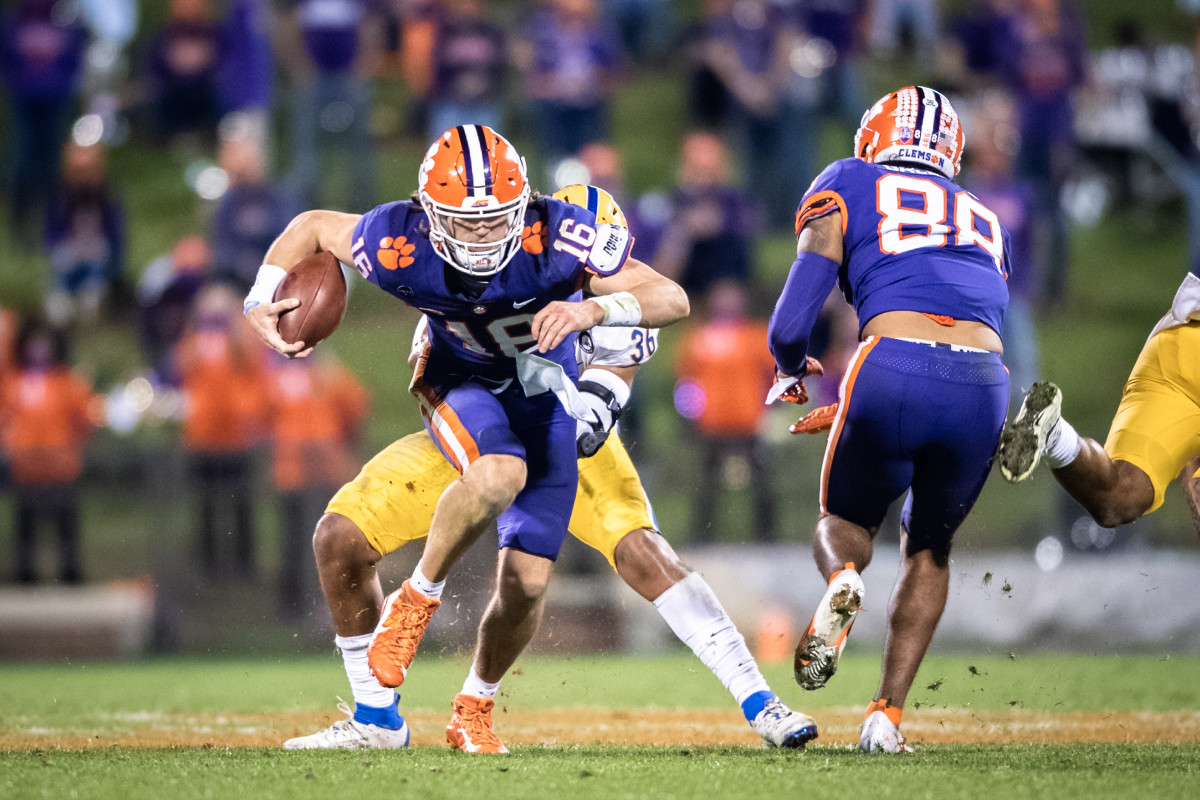 Clemson quarterback Trevor Lawrence (16) runs the ball for a first down during the third quarter against Pittsburgh at Memorial Stadium. Mandatory Credit: Ken Ruinard-USA TODAY Sports