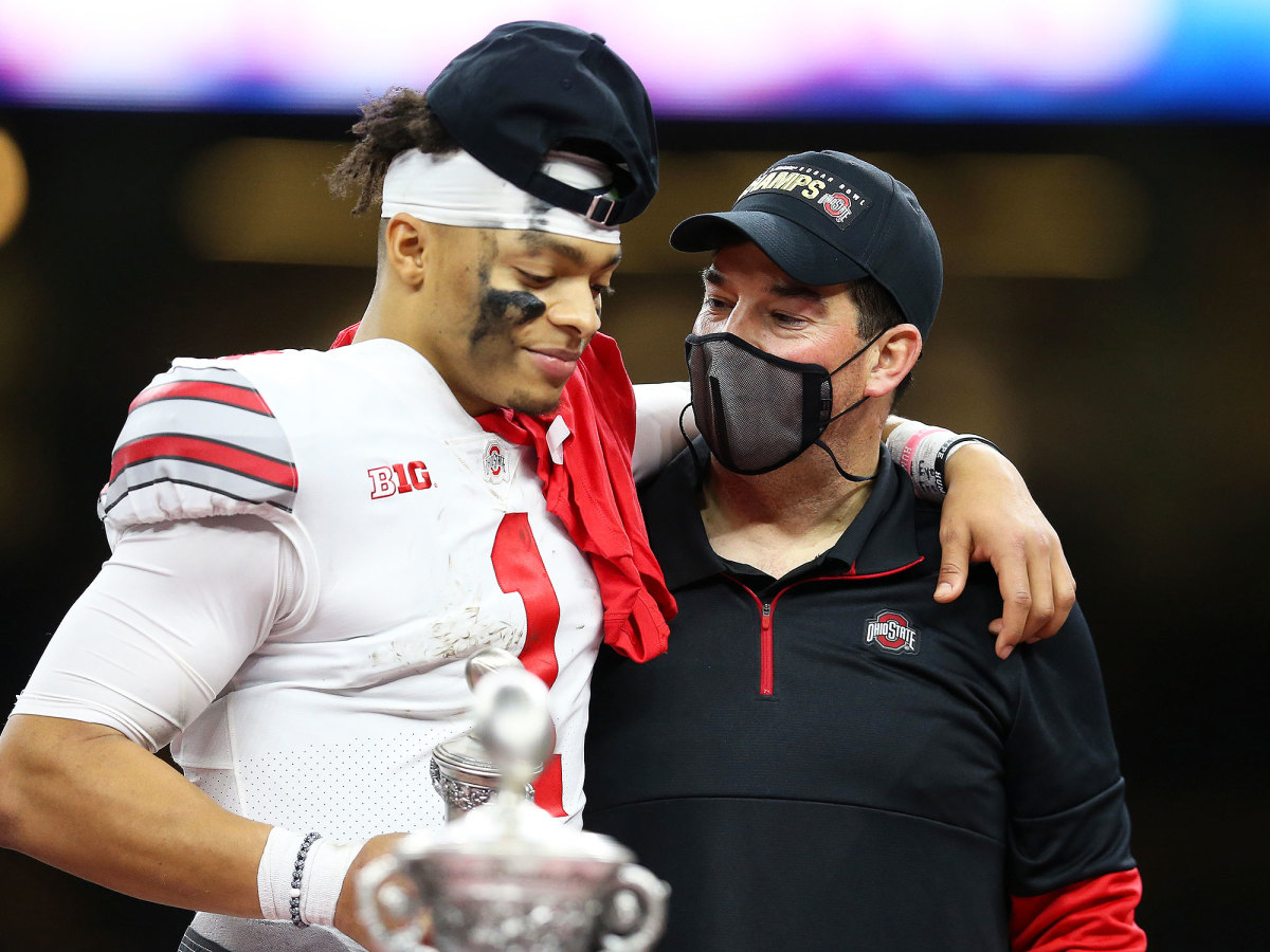 Justin Fields and Ryan Day embrace after the win over Clemson