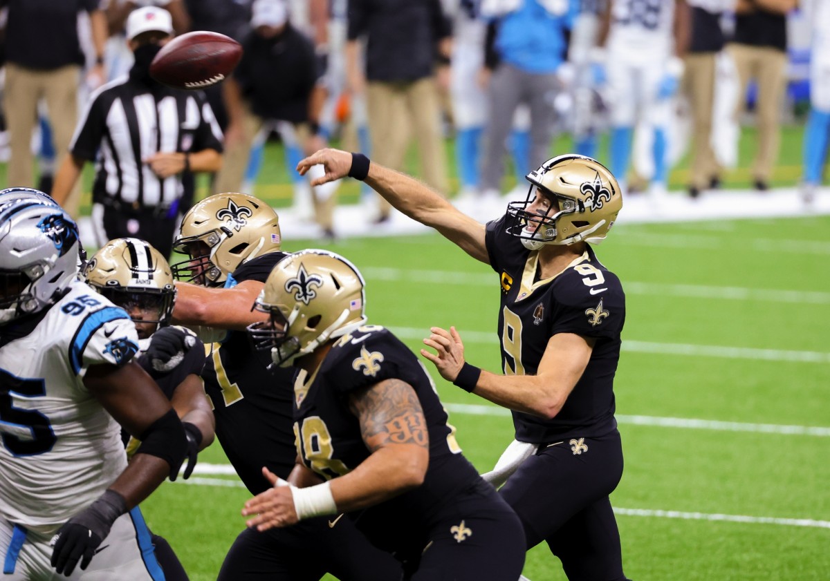 Oct 25, 2020; New Orleans, Louisiana, USA; New Orleans Saints quarterback Drew Brees (9) throws a touchdown against the Carolina Panthers during the second quarter at the Mercedes-Benz Superdome. Mandatory Credit: Derick E. Hingle-USA TODAY 