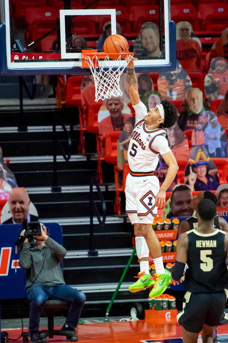 Illinois Fighting Illini guard Andre Curbelo (5) dunks against the Purdue Boilermakers during the second half at the State Farm Center.