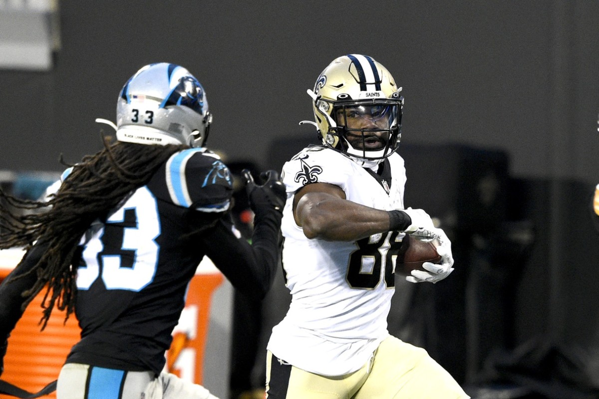 Jan 3, 2021; Charlotte, North Carolina, USA; New Orleans Saints running back Ty Montgomery (88) with the ball as Carolina Panthers free safety Tre Boston (33) defends in the second quarter at Bank of America Stadium. Mandatory Credit: Bob Donnan-USA TODAY 