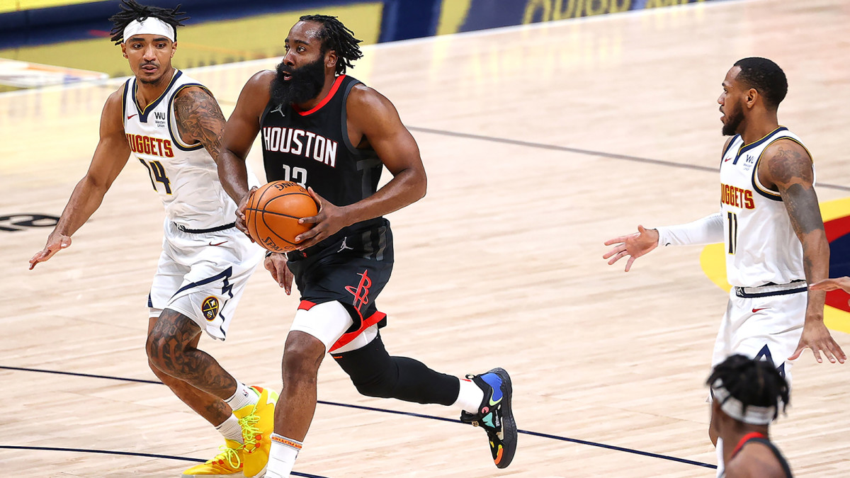 James Harden drives to the basket against the Nuggets