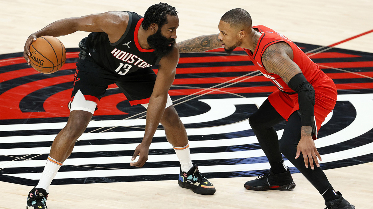 James Harden guarded by Damian Lillard