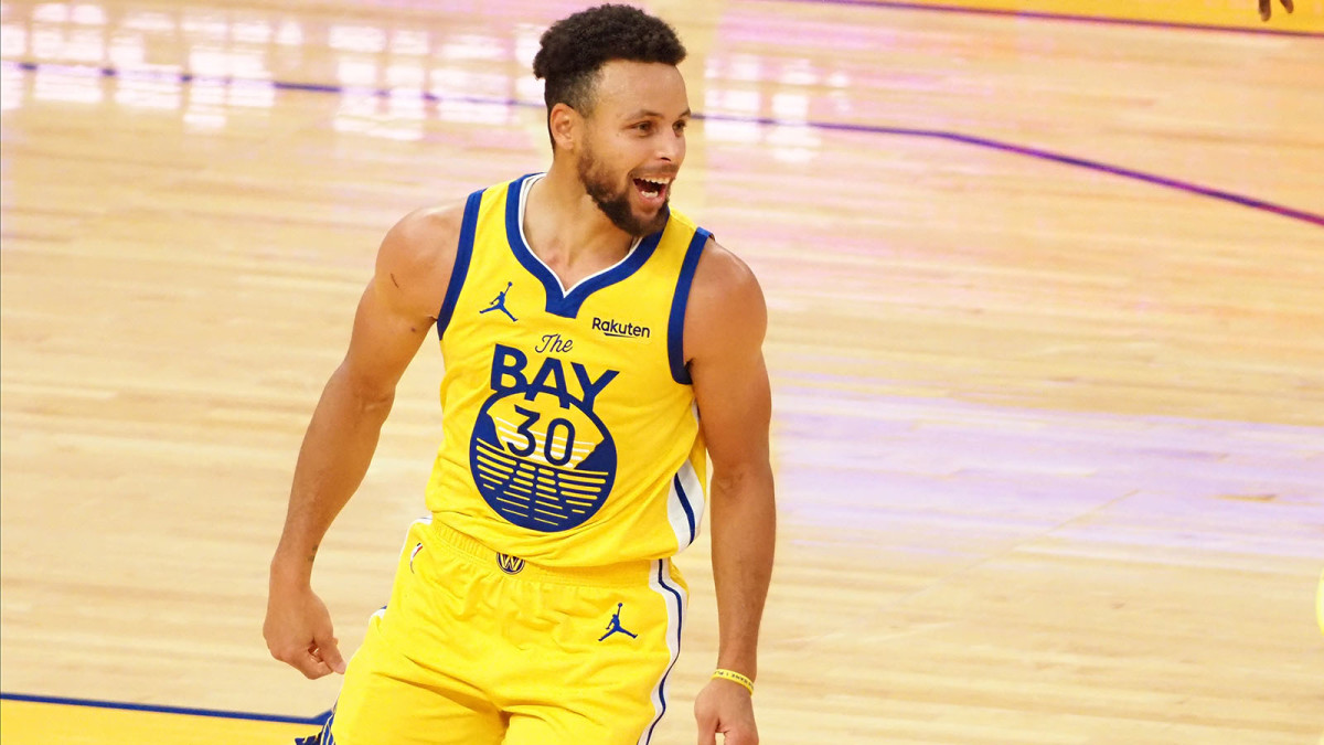 Golden State Warriors guard Stephen Curry celebrates after a basket against the Portland Trail Blazers during the fourth quarter for a career-high 62 point game