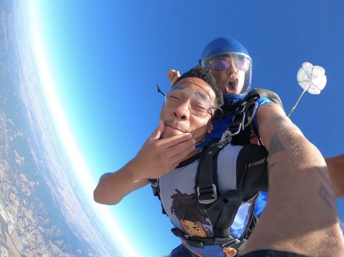 Camryn Bynum hams it up while skydiving