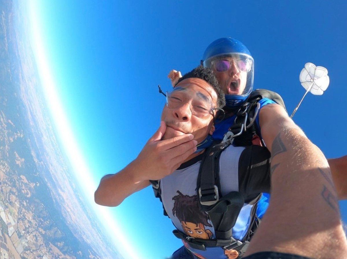 Camryn Bynum hams it up while skydiving