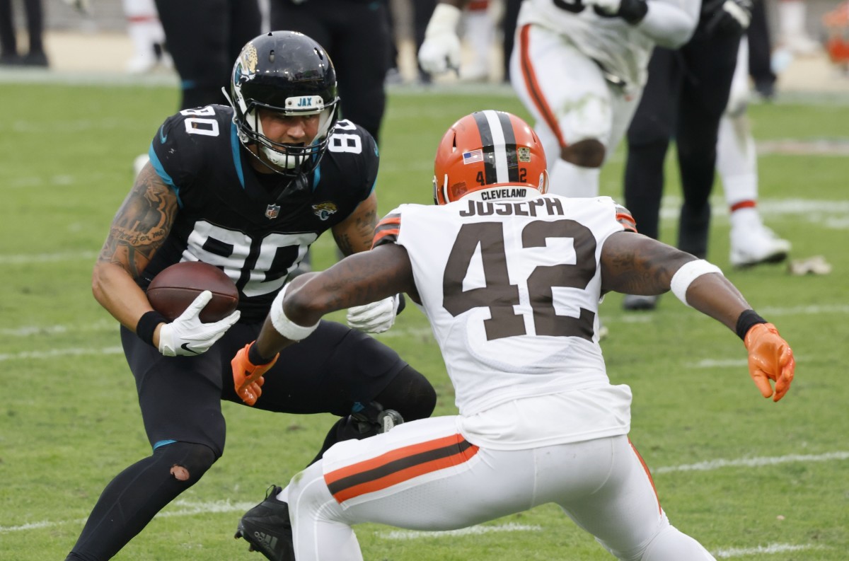 Nov 29, 2020; Jacksonville, Florida, USA; Jacksonville Jaguars tight end James O'Shaughnessy (80) runs against Cleveland Browns strong safety Karl Joseph (42) during the second half at TIAA Bank Field.
