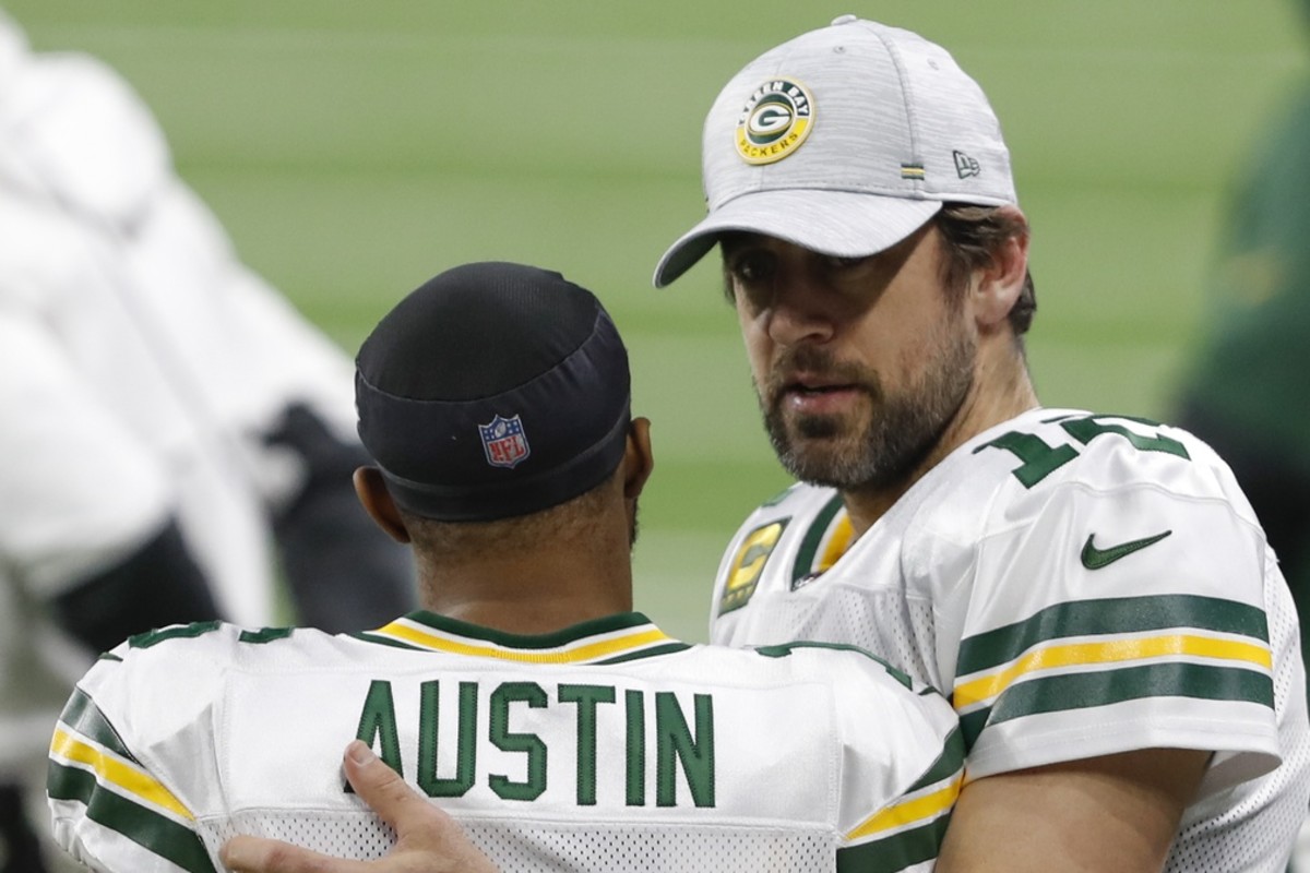 Dec 13, 2020; Detroit, Michigan, USA; Green Bay Packers quarterback Aaron Rodgers (R) talks with wide receiver Tavon Austin (16) before the game against the Detroit Lions at Ford Field.