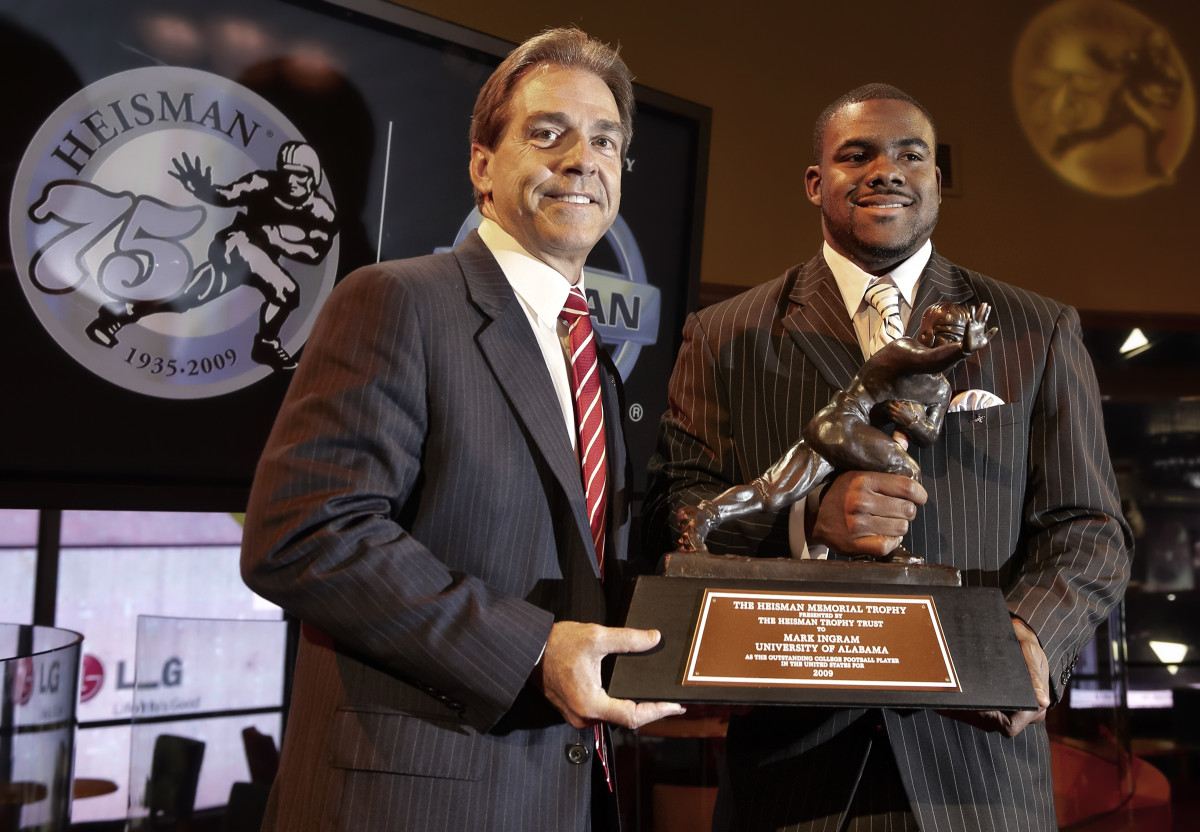 Nick Saban and Mark Ingram with the Heisman trophy