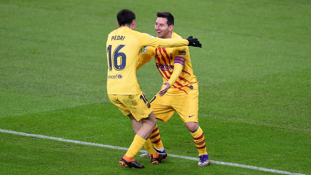 Pedri and Lionel Messi after a Barcelona goal