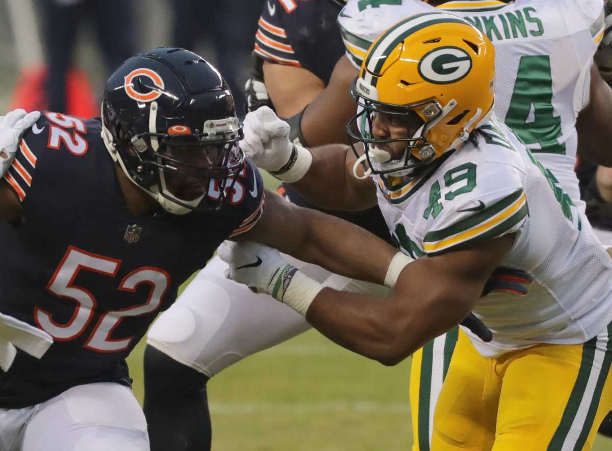 Green Bay Packers tight end Dominique Dafney (49) blocks Chicago Bears linebacker Khalil Mack (52) during the first quarter of their game Sunday, January 3, 2021 at Soldier Field in Chicago.