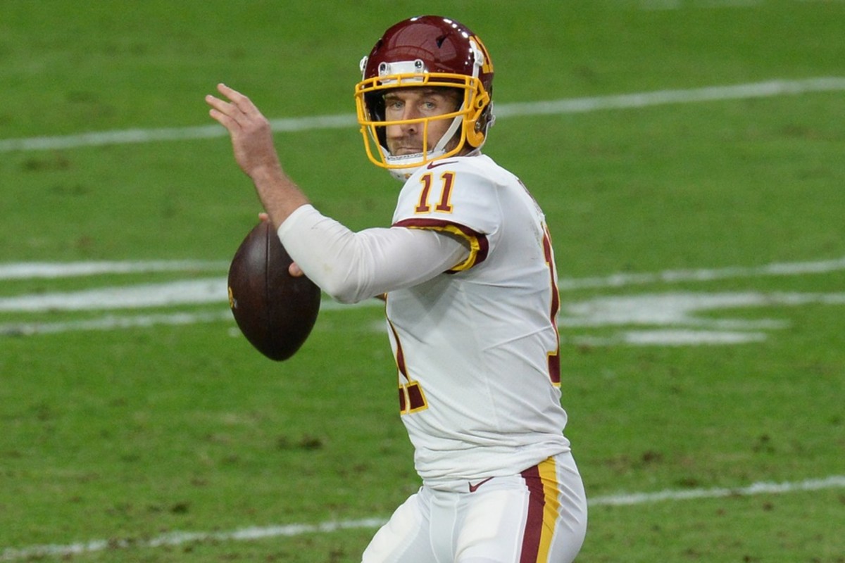 Dec 13, 2020; Glendale, Arizona, USA; Washington Football Team quarterback Alex Smith (11) throws a pass against the San Francisco 49ers during the first half at State Farm Stadium.