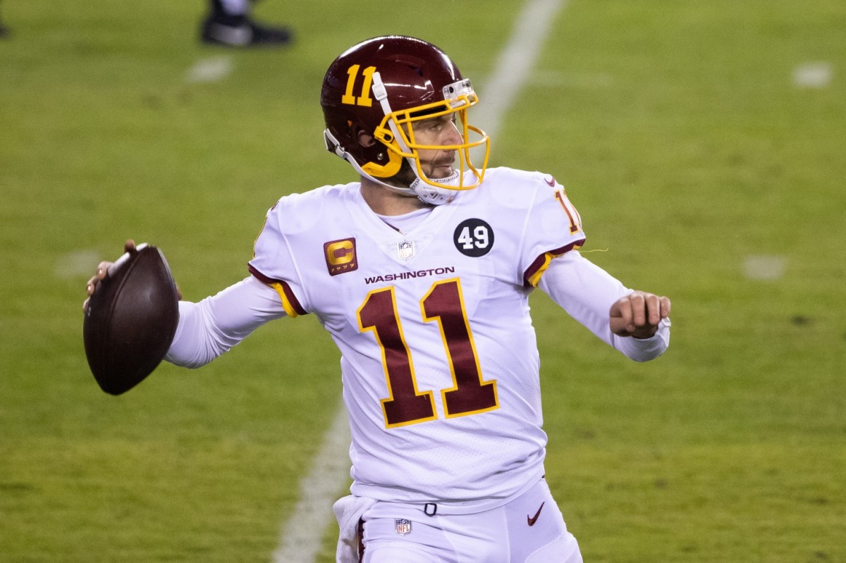 Jan 3, 2021; Philadelphia, Pennsylvania, USA; Washington Football Team quarterback Alex Smith (11) passes the ball against the Philadelphia Eagles during the third quarter at Lincoln Financial Field.