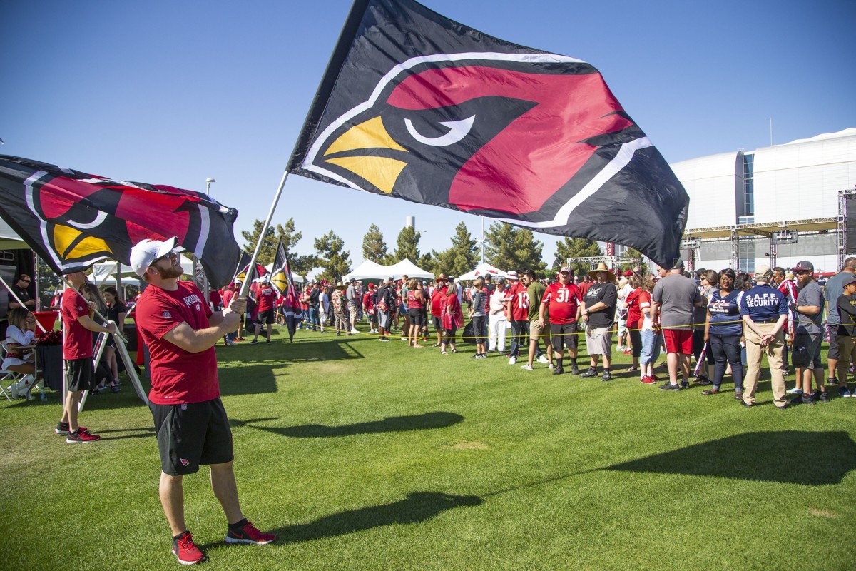 Arizona Cardinals fans arrive at the NFL Draft party on the Great Lawn outside State Farm Stadium, Thursday, April 25, 2019.