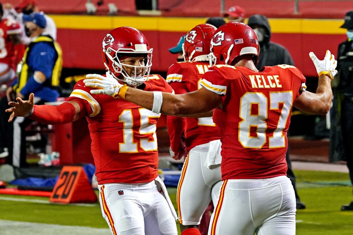 Sep 10, 2020; Kansas City, Missouri, USA; Kansas City Chiefs quarterback Patrick Mahomes (15) and tight end Travis Kelce (87) celebrate after a touchdown during the first half against the Houston Texans at Arrowhead Stadium. Mandatory Credit: Denny Medley-USA TODAY Sports