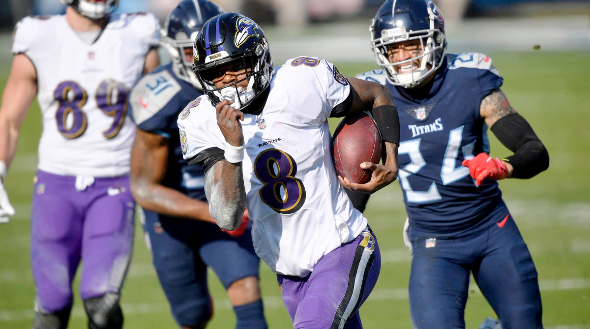 Baltimore Ravens quarterback Lamar Jackson (8) runs for a touchdown during the Tennessee Titans game against the Baltimore Ravens in Nashville on January 10, 2021.