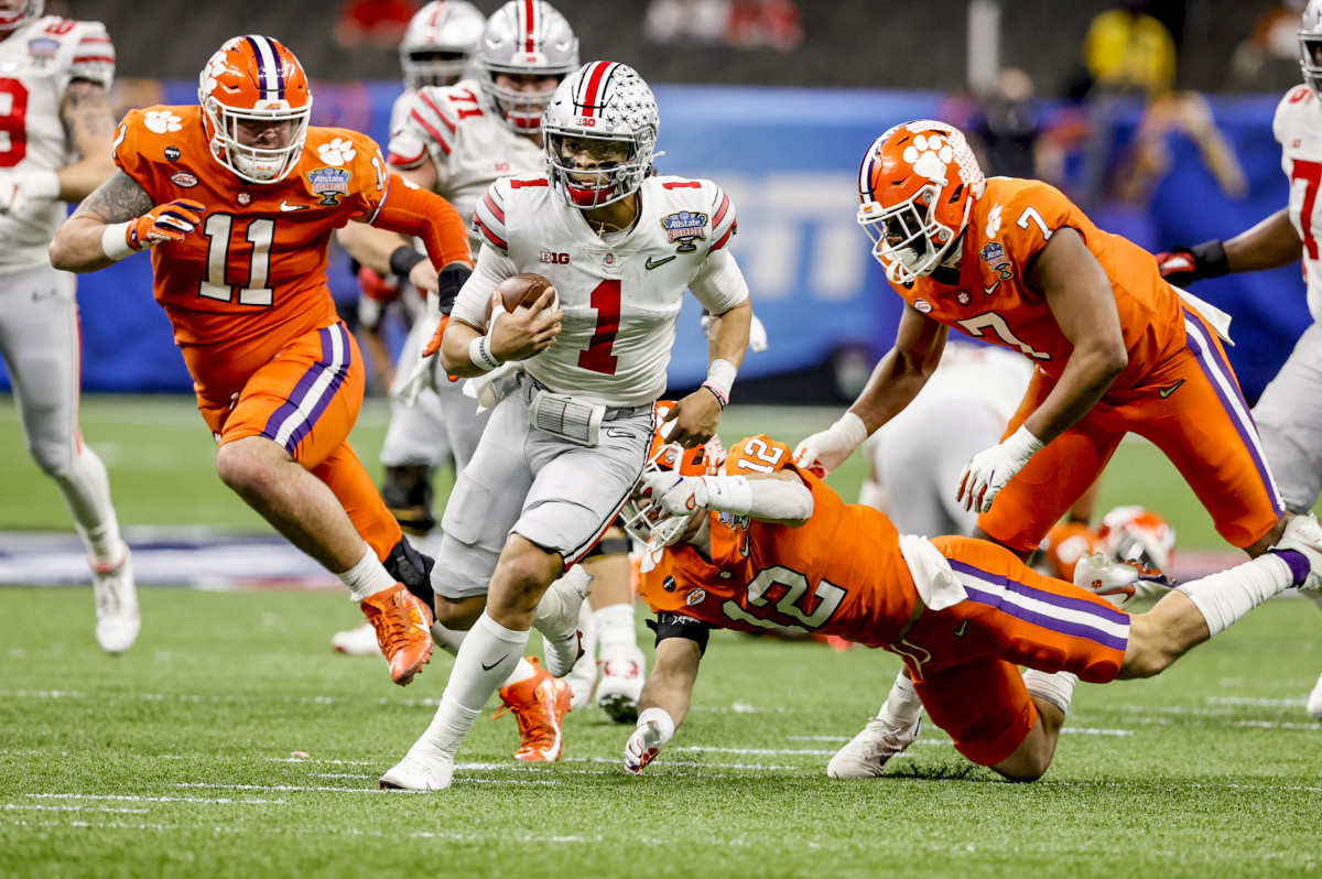 Ohio State QB Justin Fields runs during the playoff semifinal