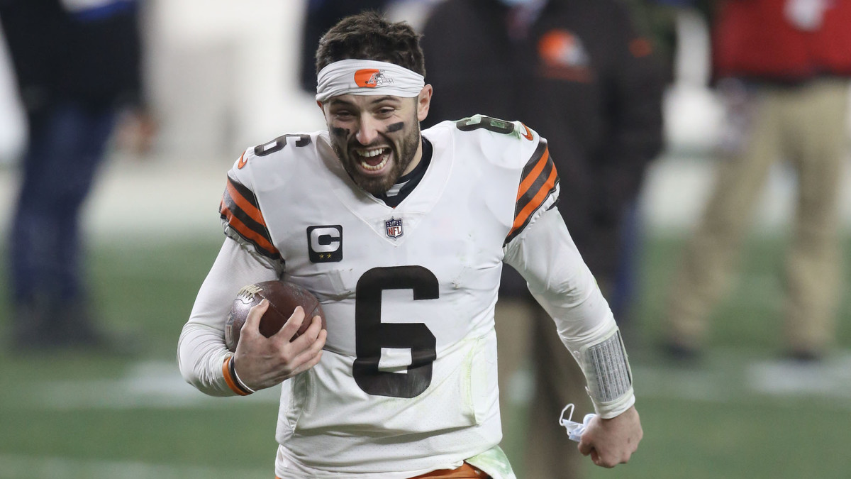 Baker Mayfield celebrates on his way off the field after Browns' playoff upset of the Steelers