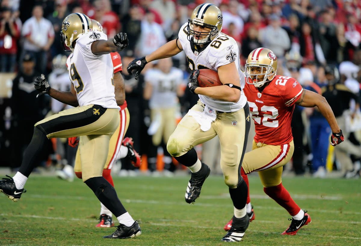 Jan 14, 2012; San Francisco, CA, USA; New Orleans Saints tight end Jimmy Graham (80) runs with the ball past San Francisco 49ers cornerback Carlos Rogers (22) during the fourth quarter of the 2011 NFC divisional playoff game at Candlestick Park. The 49ers defeated the Saints 36-32. Mandatory Credit: Kyle Terada-USA TODAY 