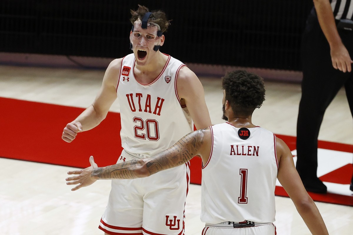 Jan 9, 2021; Salt Lake City, Utah, USA; Utah Utes forward Mikael Jantunen (20) reacts with forward Timmy Allen (1) after a basket in the final seconds of the first half against the Oregon Ducks at Jon M. Huntsman Center.