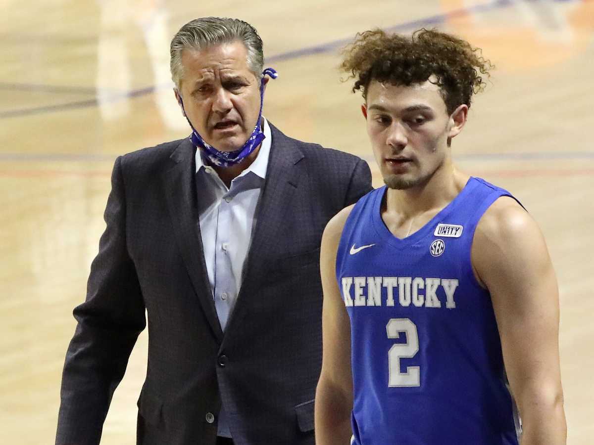 Kentucky head coach John Calipari talks to his point guard Devin Askew (2) as he comes off the court during an SEC basketball game against Florida held at Exactech Arena in Gainesville Fla. Jan. 9, 2021.