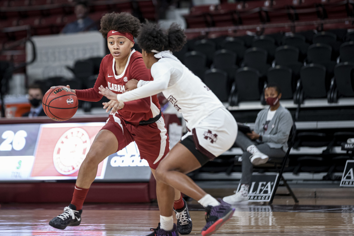Alabama's Megan Abrams dribbles the ball against Mississippi State's Myah Taylor on Thursday night. The Crimson Tide came away with an 86-78 win over the Bulldogs. (Photo courtesy of Mississippi State athletics)