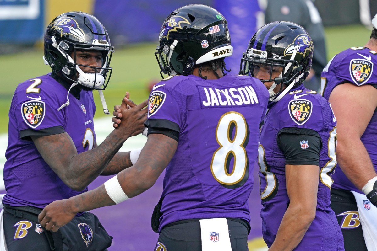 Dec 20, 2020; Baltimore, Maryland, USA; Baltimore Ravens quarterback Lamar Jackson (8) greets quarterback Tyler Huntley (2) prior to a game against the Jacksonville Jaguars at M&T Bank Stadium.