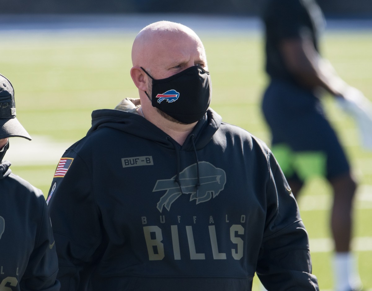 Bills offensive coordinator Brian Daboll walks the field prior to a game against the Seattle Seahawks at Bills Stadium.