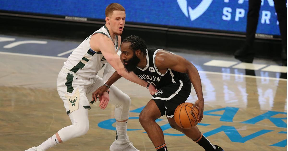 Jan 18, 2021; Brooklyn, New York, USA; Brooklyn Nets shooting guard James Harden (13) controls the ball against Milwaukee Bucks shooting guard Donte DiVincenzo (0) during the fourth quarter at Barclays Center. The Nets defeated the Bucks 125-123. Mandatory Credit: Brad Penner-USA TODAY Sports