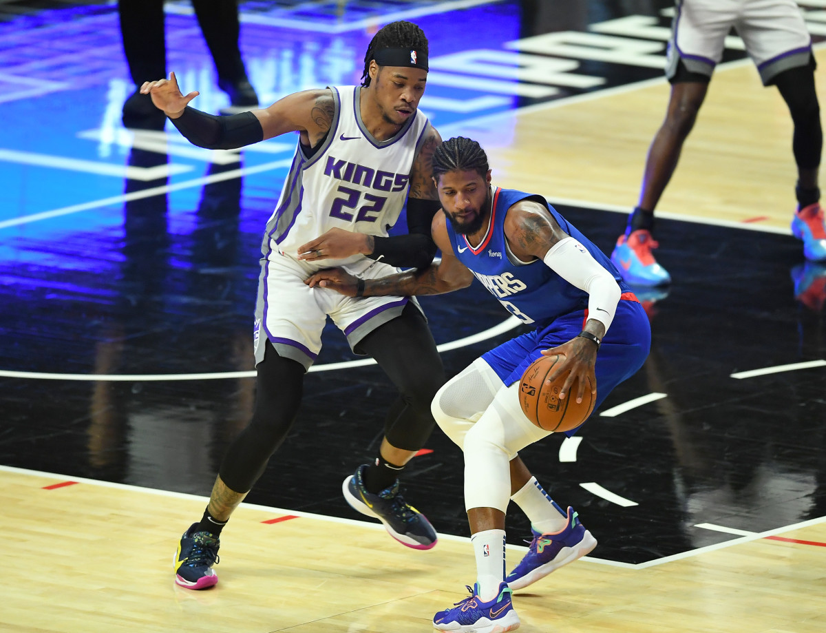 Jan 20, 2021; Los Angeles, California, USA; Sacramento Kings center Richaun Holmes (22) guards Los Angeles Clippers guard Paul George (13) in the first half of the game at Staples Center. Mandatory Credit: Jayne Kamin-Oncea-USA TODAY Sports