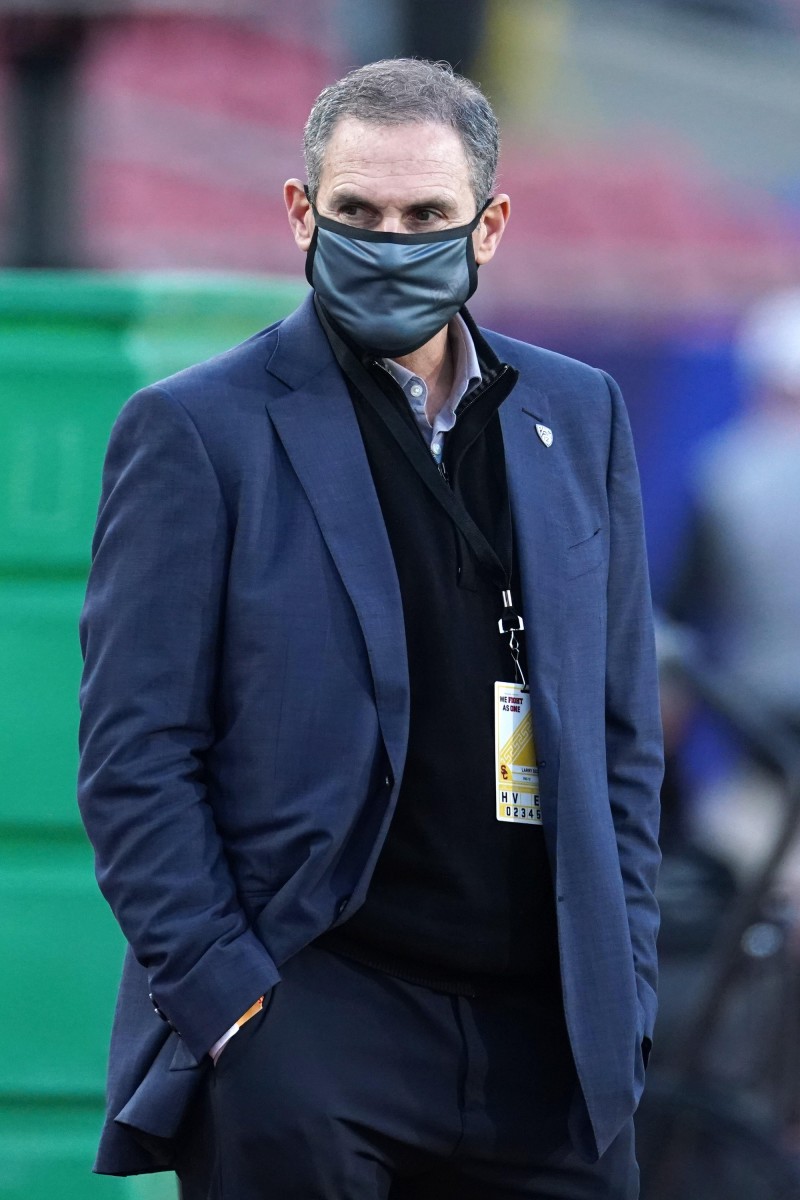 Dec 18, 2020; Los Angeles, California, USA; Pac-12 commissioner Larry Scott watches during the Pac-12 Championship between the Oregon Ducks and the Southern California Trojans at United Airlines Field at Los Angeles Memorial Coliseum.