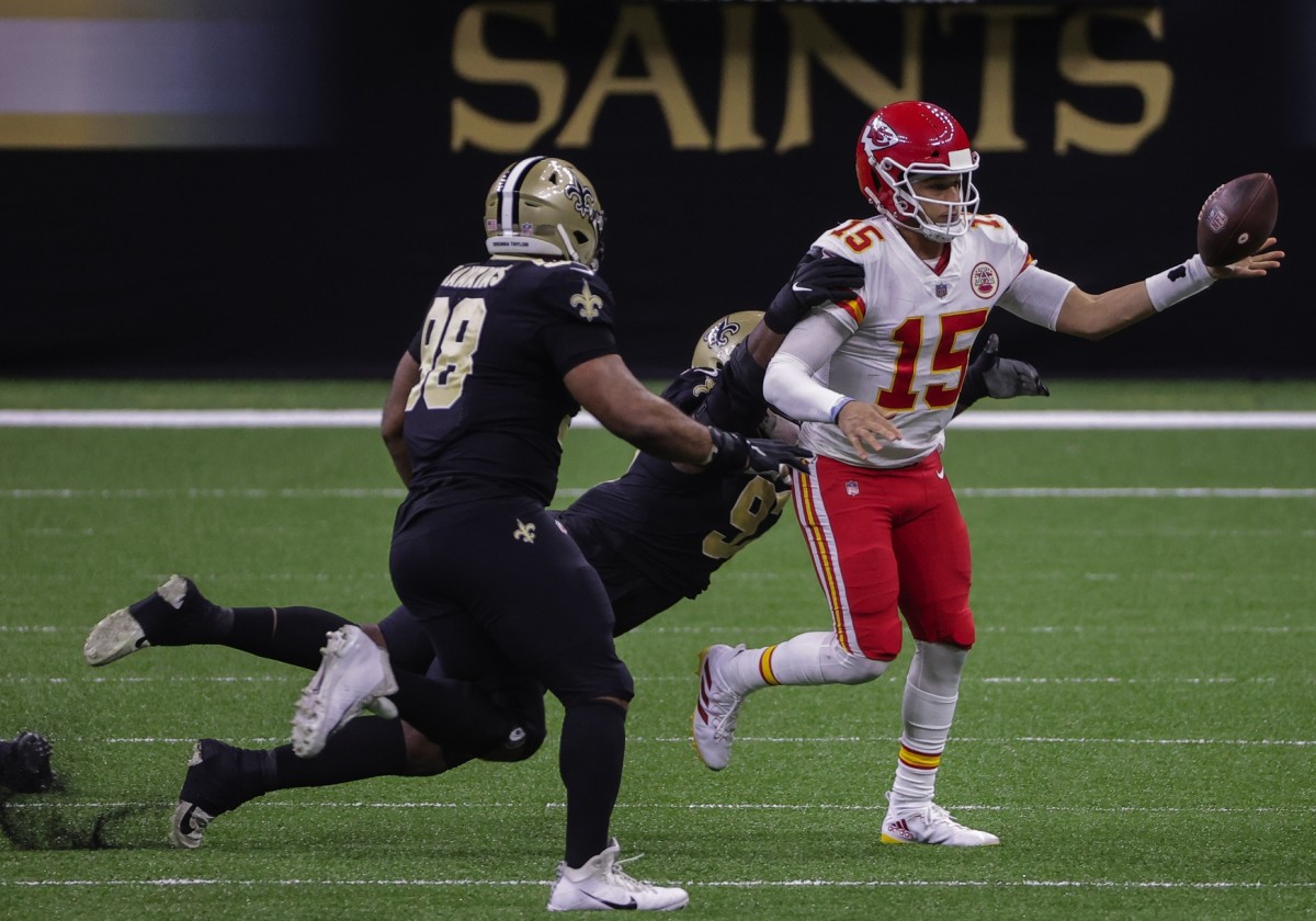 Dec 20, 2020; New Orleans, Louisiana, USA; Saints defensive end Malcolm Roach (97) forces a fumble by Chiefs quarterback Patrick Mahomes (15) during the first half at the Mercedes-Benz Superdome. Mandatory Credit: Derick E. Hingle-USA TODAY Sports