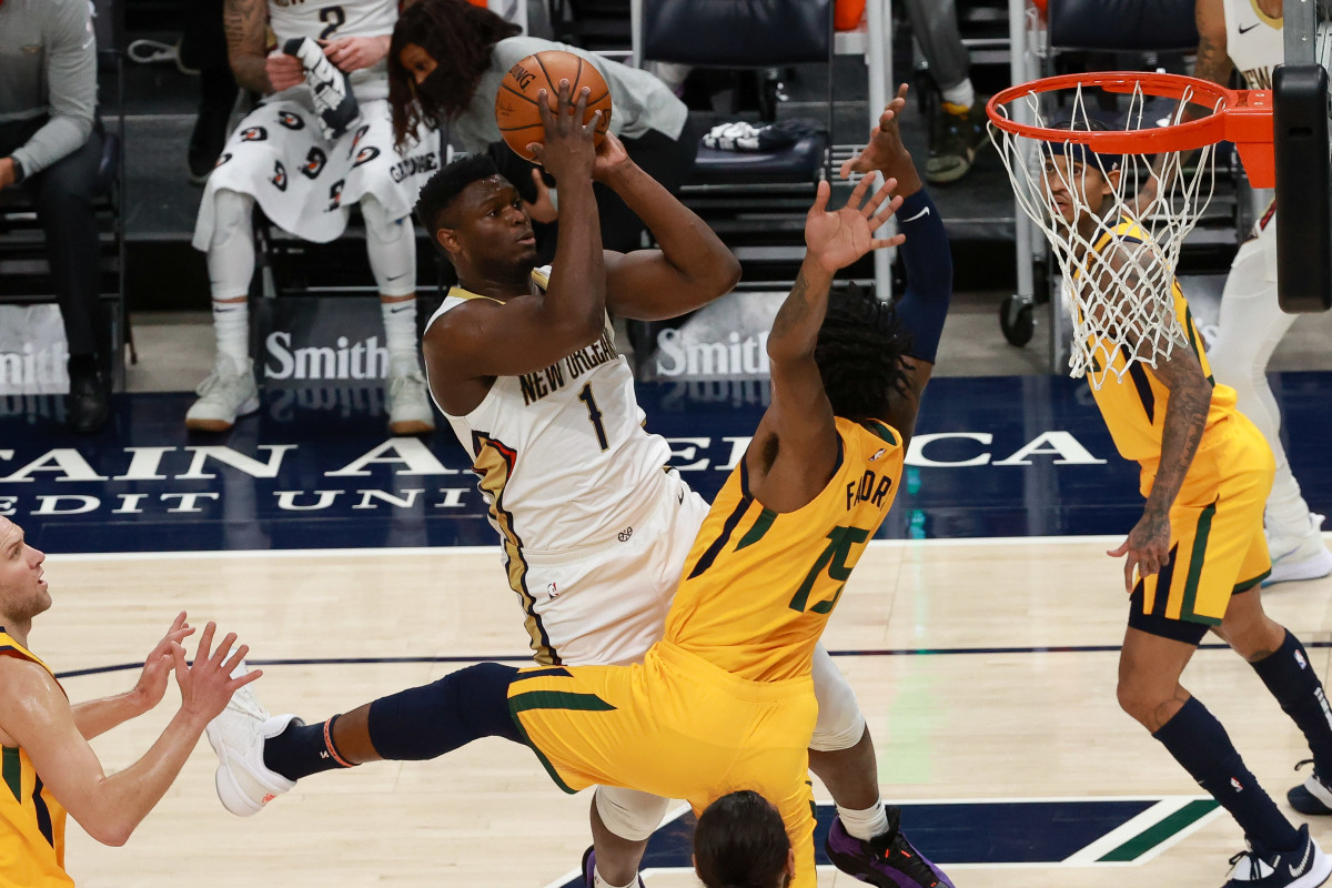 Jan 19, 2021; Salt Lake City, Utah, USA; New Orleans Pelicans forward Zion Williamson (1) shoots the ball over Utah Jazz center Derrick Favors (15) during the first quarter at Vivint Smart Home Arena. Mandatory Credit: Chris Nicoll-USA TODAY Sports