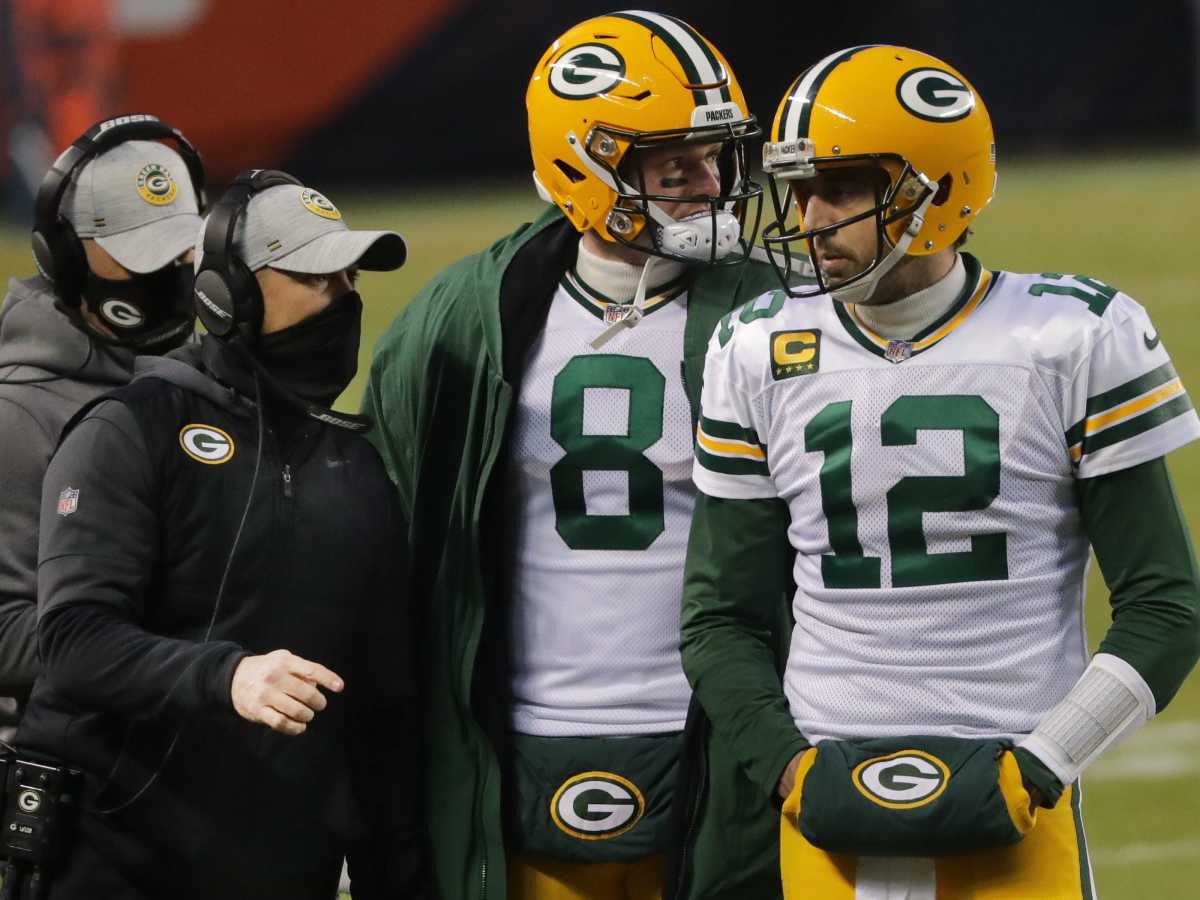 Green Bay Packers head coach Matt LaFleur talks with quarterbacks Aaron Rodgers (12) and Tim Boyle (8)