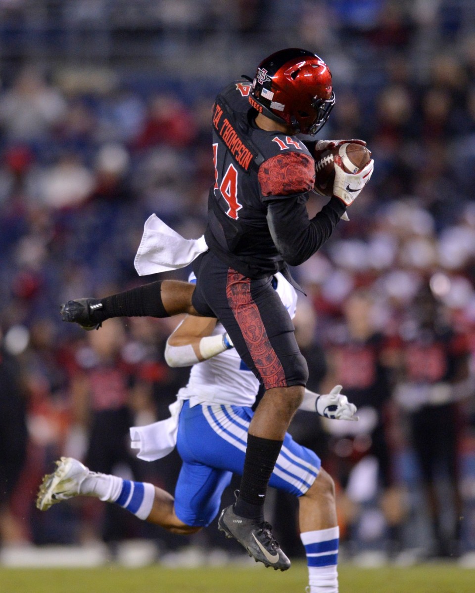Nov 30, 2019; San Diego, CA, USA; San Diego State Aztecs safety Tariq Thompson (14) intercepts a pass intended for Brigham Young Cougars wide receiver Aleva Hifo (15) during the fourth quarter at SDCCU Stadium. Mandatory Credit: Jake Roth-USA TODAY Sports