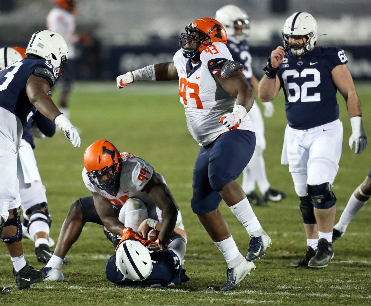 Illinois Fighting Illini defensive linesman Calvin Avery (93) reacts following a sack on Penn State Nittany Lions quarterback Sean Clifford (14) during the fourth quarter at Beaver Stadium. Penn State defeated Illinois 56-21.