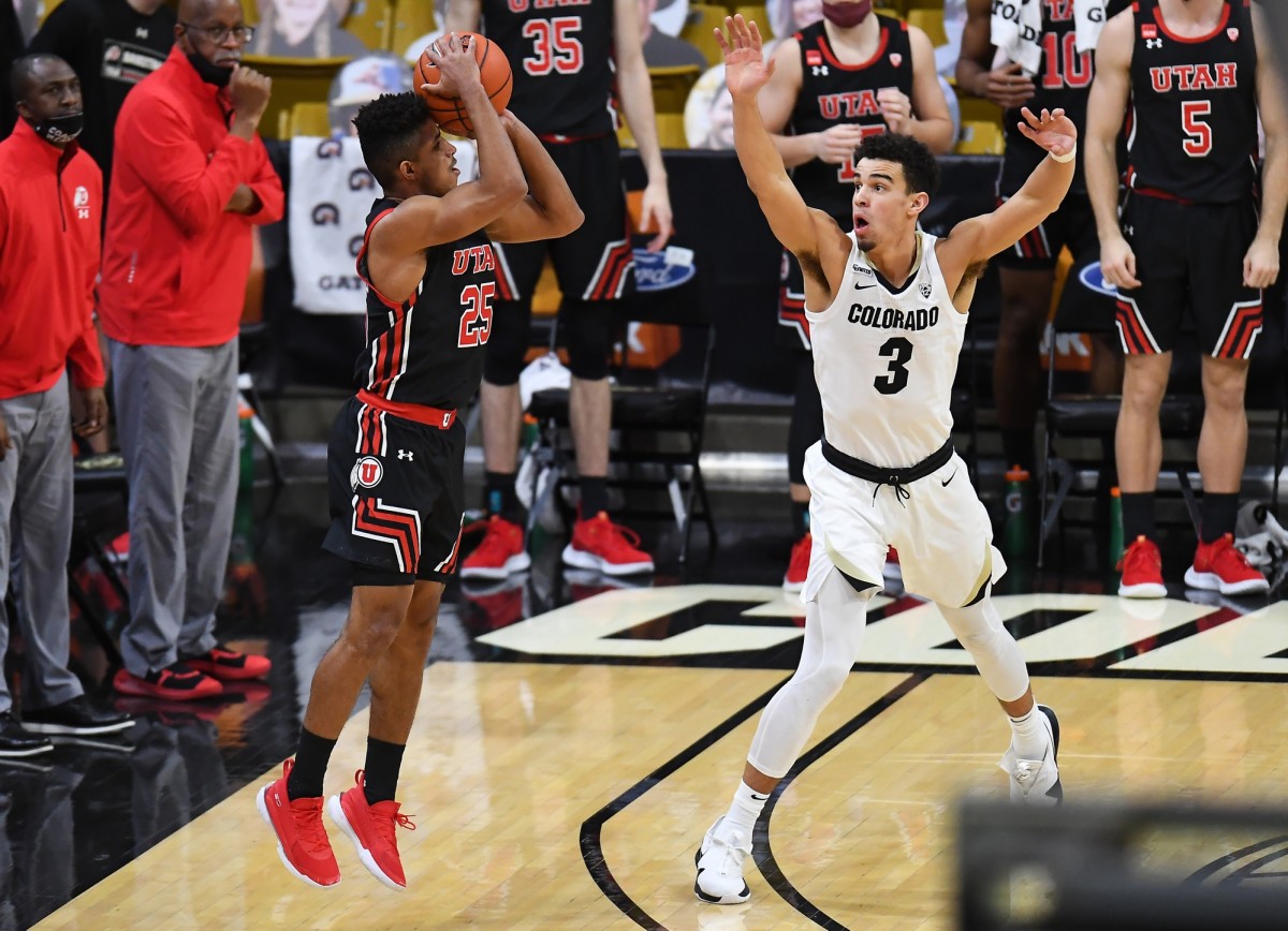 Jan 30, 2021; Boulder, Colorado, USA; Utah Utes guard Alfonso Plummer (25) ties the game up on this three point basket over Colorado Buffaloes guard Maddox Daniels (3) in the second half at the CU Events Center.